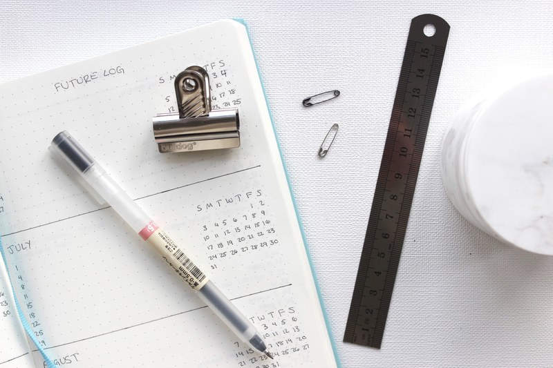 an agenda with a pen clip ruler and other items, _journalling 4k