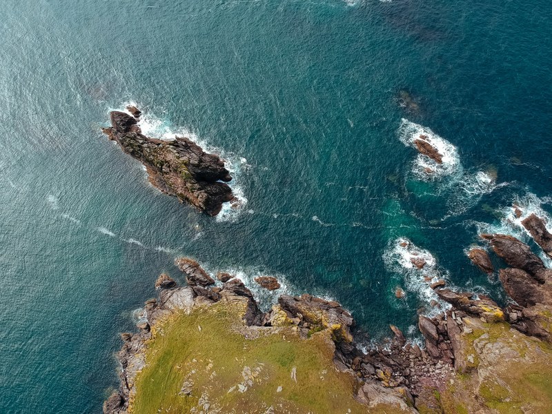 rock sea island and ocean 4k