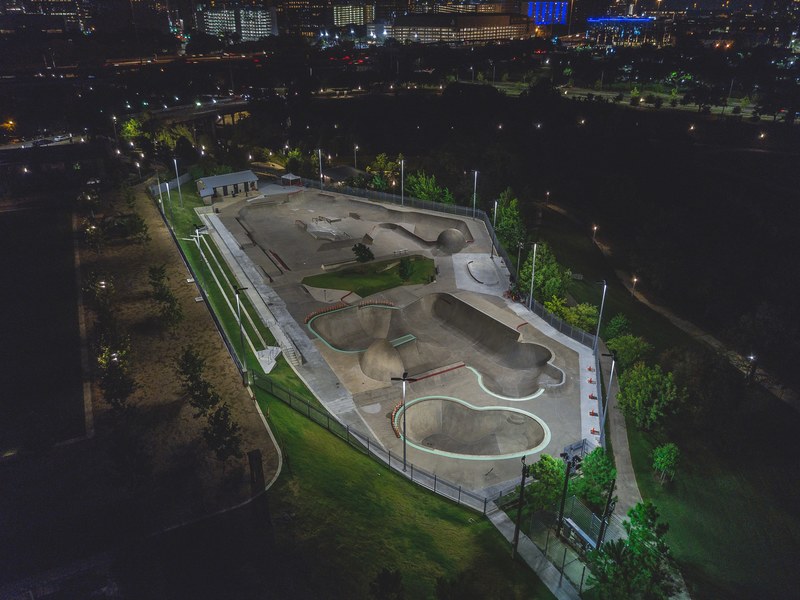a drone shot of a skate park at night in washington ave_ memorial park houston texas united states, jamail skatepark 4k