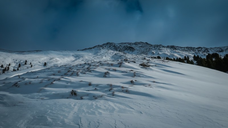 a snow covered mountain that reaches 2022 meters at the top located in juifenalm, sledding down the alps 4k