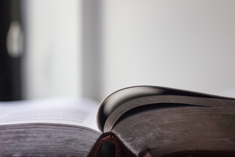 a side view of an open thick book, open thick book 4k