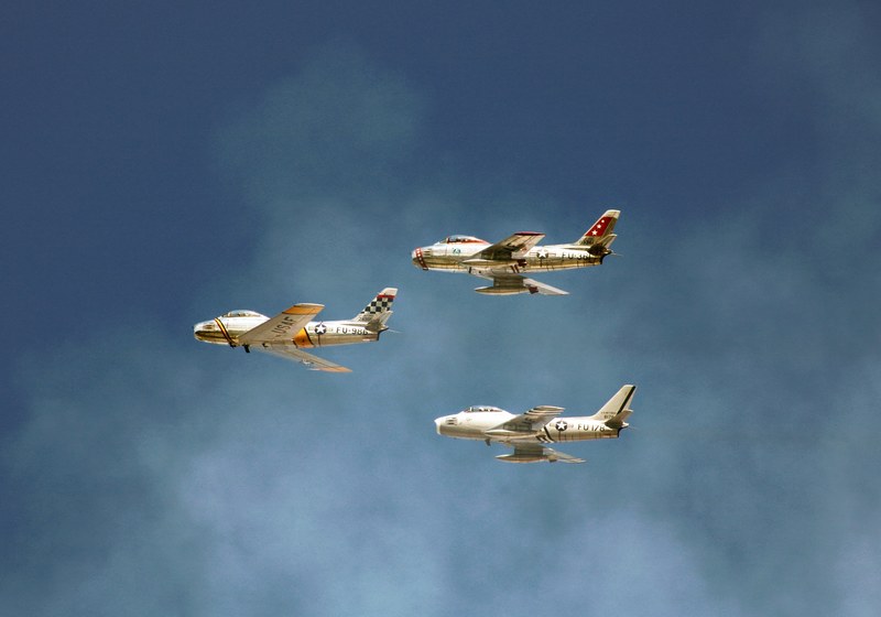 three retro airplanes fly across a cloudy blue sky, sound of freedom 4k