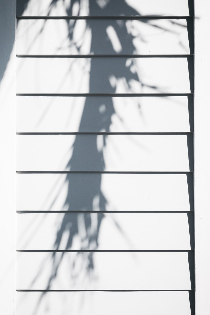 a long shadow on white wooden wall panels, shadow on wood_ 4k