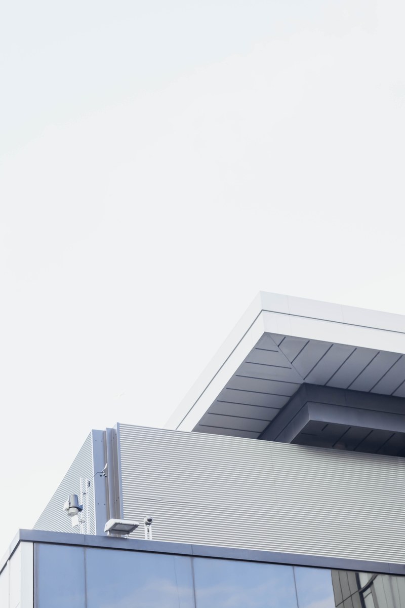 the edge of a modern building with a white roof in london, minimal white facade edge 4k