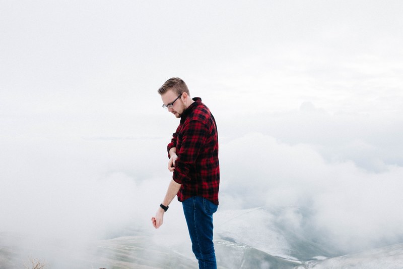 portrait of a man in lewiston standing atop a mountain the background landscape covered in fog, portrait of a man in lewiston in the fog 4k