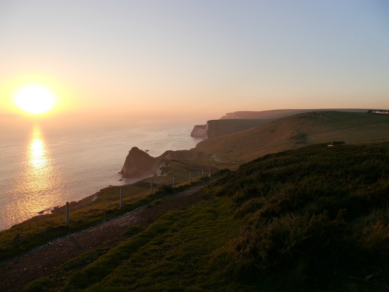 green field cliffs on the bournemouth coastline at sunset, coastline at sunset 4k