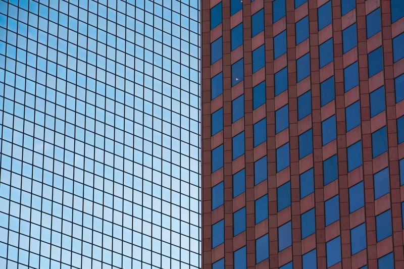 geometrical patterns formed by the edifices of two buildings, honeycomb window pattern 4k