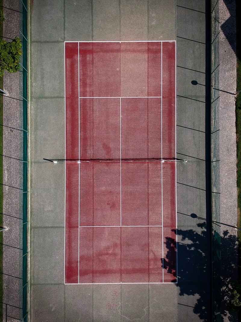 a drone shot of a red tennis court, my first drone picture_ 4k