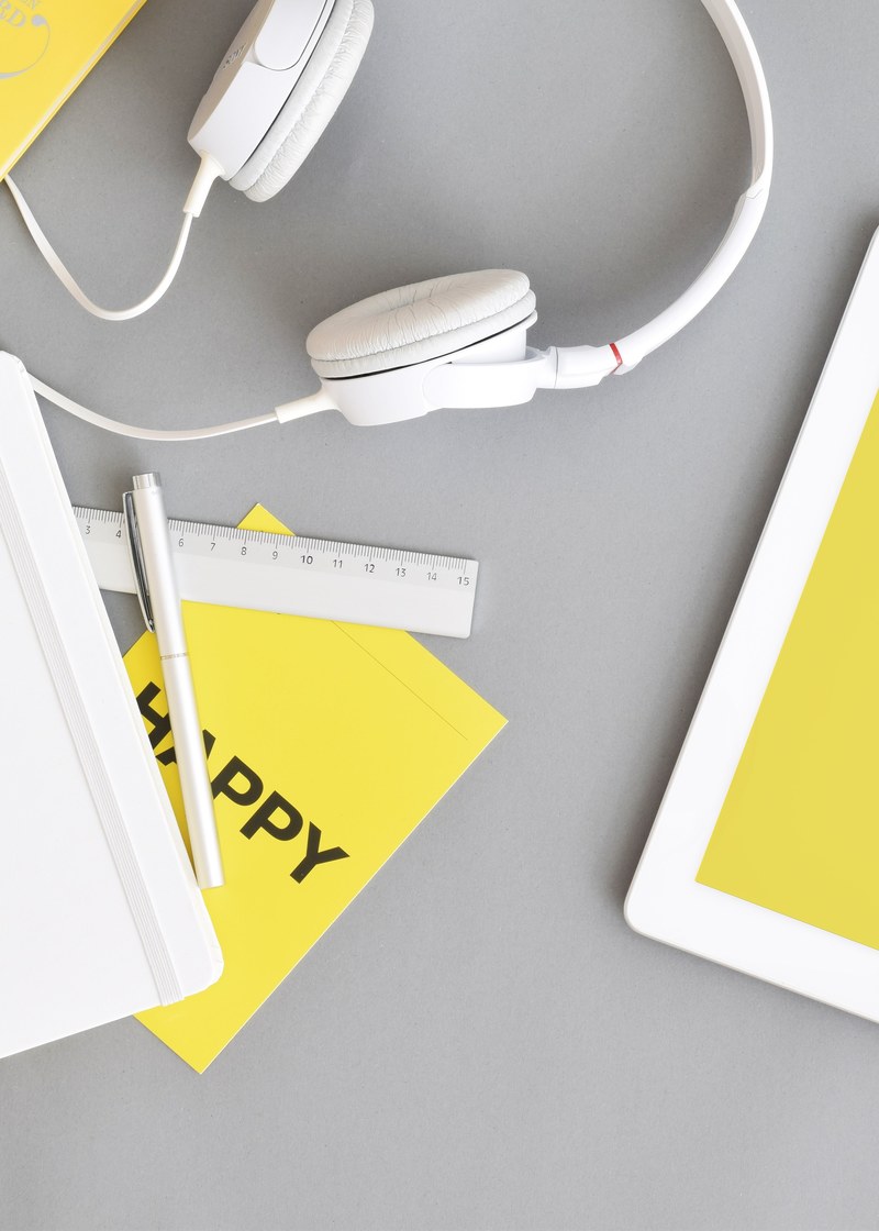 white headphones on a gray surface, _grey and yellow desk 4k