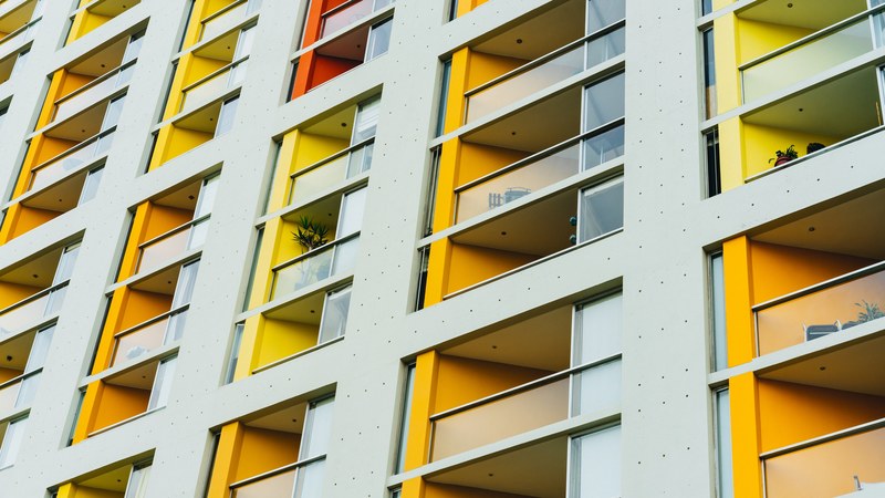 balconies with their walls painted in various colors in an apartment block, colorful balconies 4k