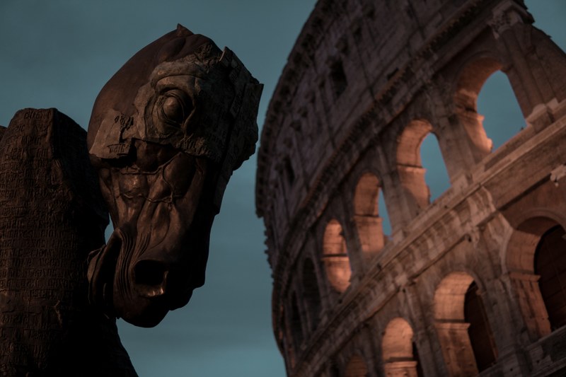 a horse head sculpture next to the colosseum at dusk, dark horse 4k