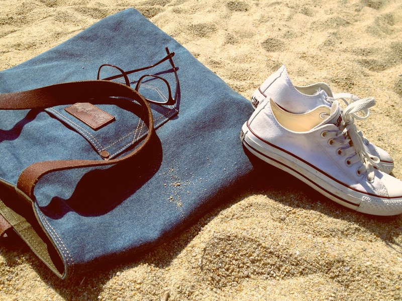 denim bag sunglasses and converse chuck taylor sneakers on the sand beach, converse on sand 4k