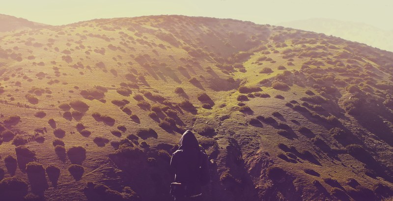 a person viewing from a mountainous hill in asilah in morocco taken during golden hour, asilah mountain review 4k