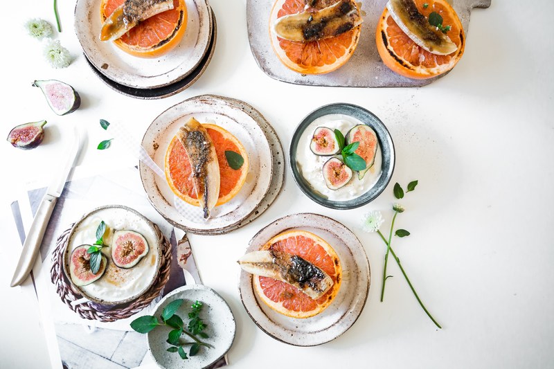 overhead view of fresh grapefruit topped with nuts and figs over yogurt, brunch brulee 4k