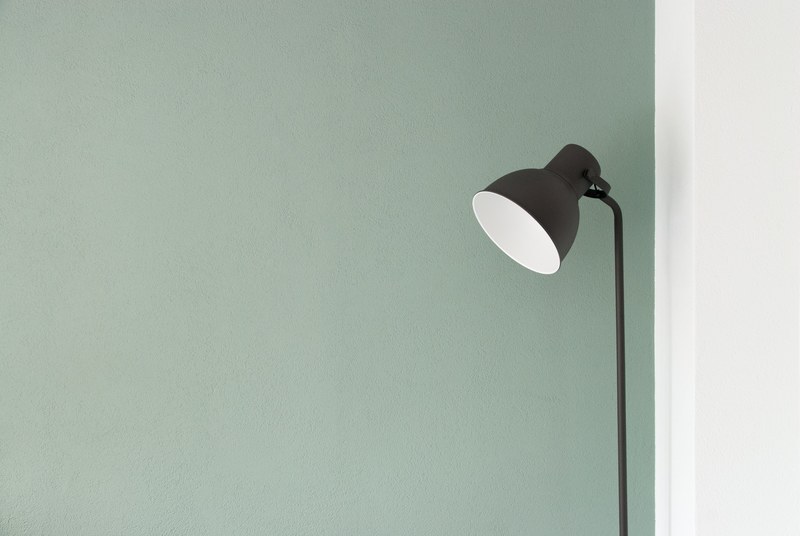 a floor lamp against a pastel green wall, floor lamp near a wall 4k