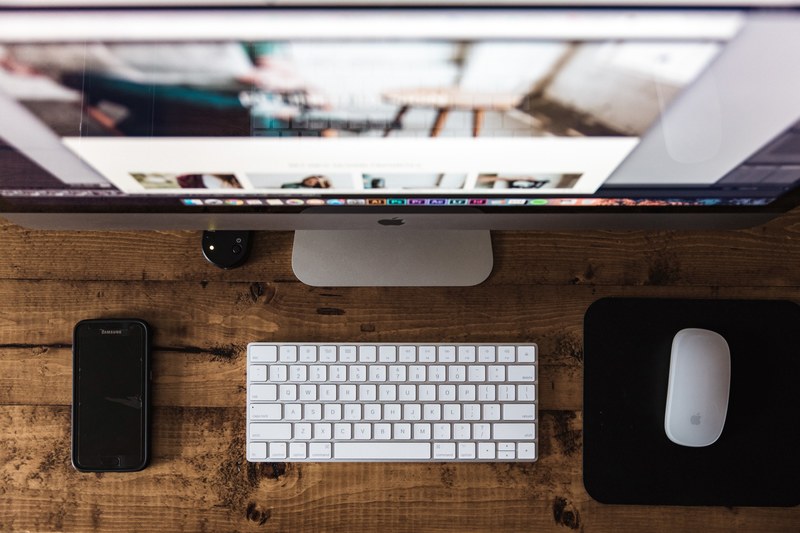 a downward view of a mac desktop monitor keyboard and mouse, _staring down at mac desktop 4k