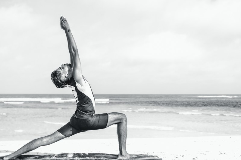 asian yoga man practice yoga on the beach 3 4k