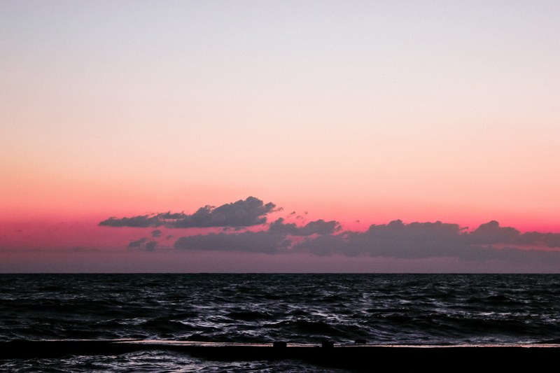 seascape view from adler with red cloudy sky that becomes clear and pale, seascape and red sky at dawn or dusk 4k
