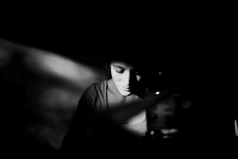 black and white shot of woman sitting in shadow in willoughby, woman in shadow willoughby 4k