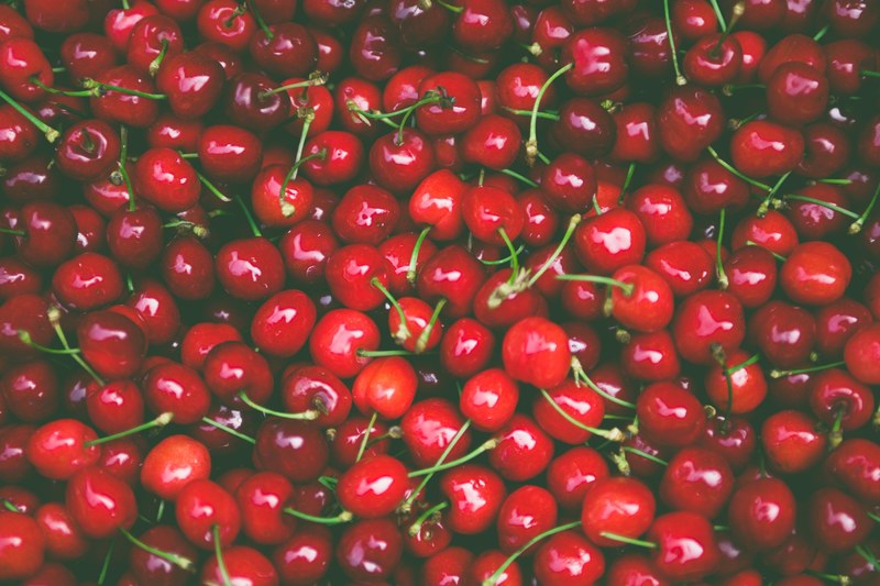 pile of fresh red cherries on the stem, pile of cherries 4k