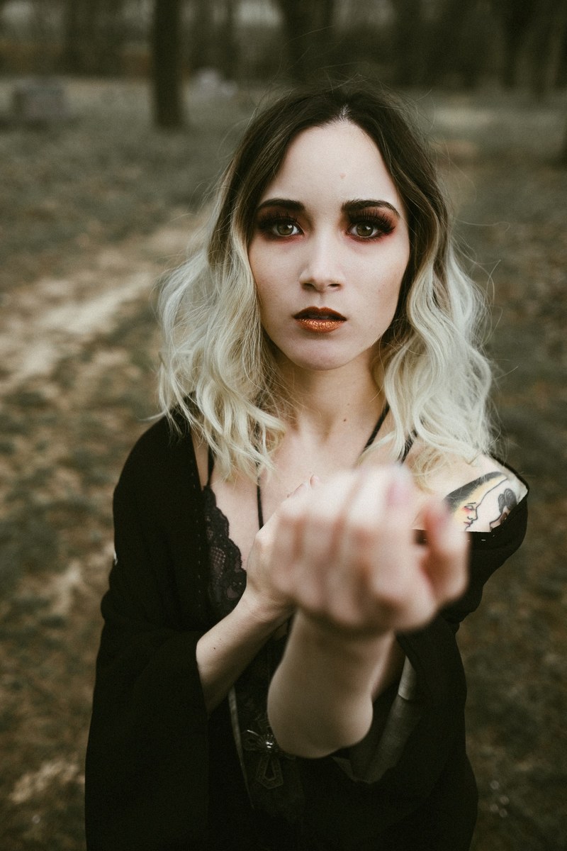 blonde woman with a tattoo on her arm wearing black in the woods, _blonde woman with tattoo 4k