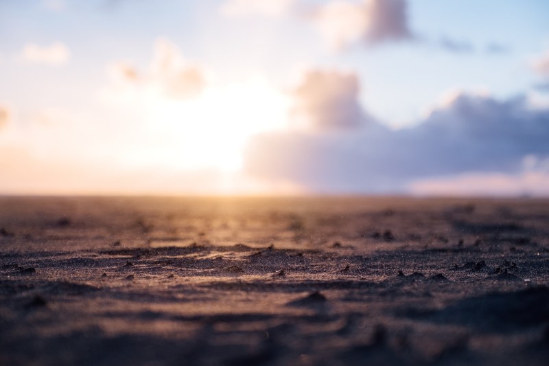 rain rippling the ocean surface in ocean beach at sunset, sunset sandstorm 4k