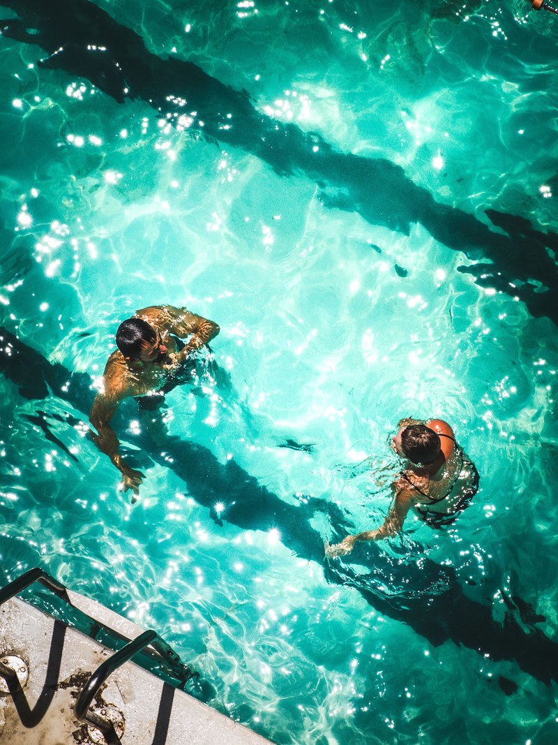 drone view of two persons in the bondi icebergs pool, couple in a pool 4k