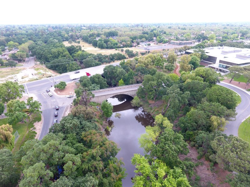 oblique aerial photo drone photo creek and bridge 4k