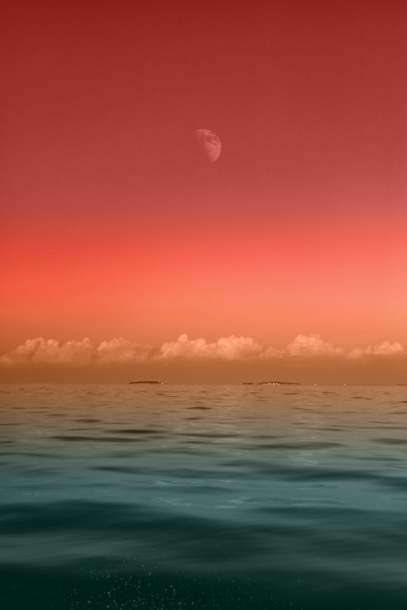 the sky and sea appear in gradients on a cloudy day as a hazy moon rises, new horizons 4k