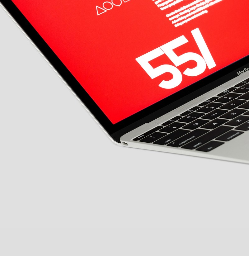 macro of corner of laptop computer with red symbol on the screen, macro laptop corner 4k