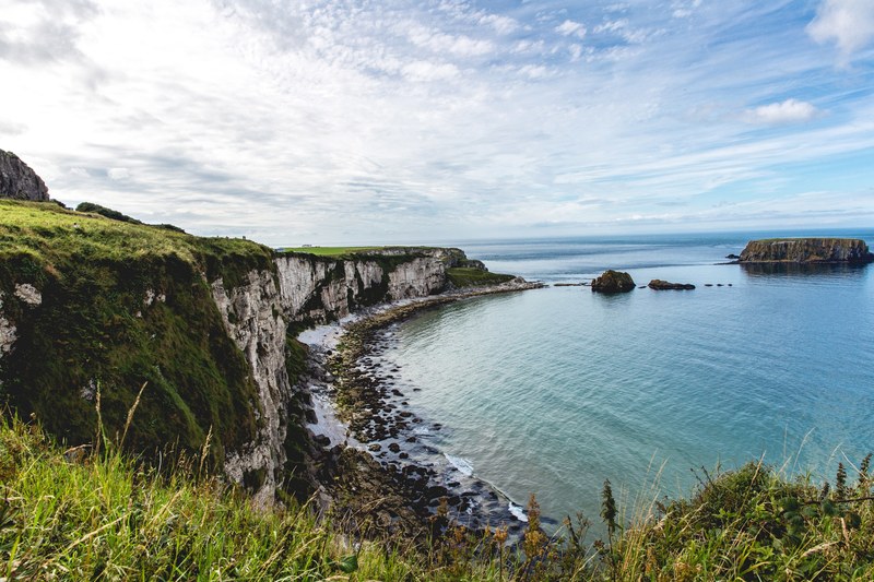 view of the coastal bay with tall cliffs in northern ireland, coastal bay cliffs 4k