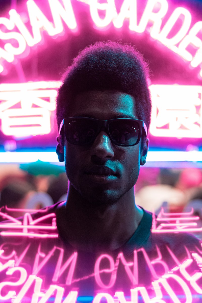 a man with sunglasses and a small afro, _bright nights 4k