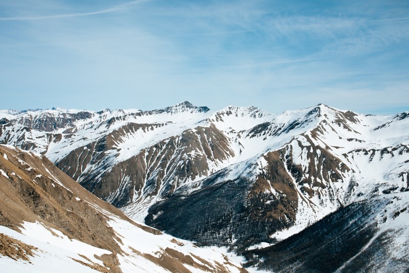 snow covered mountain range at les orres france, snow on brown slopes 4k