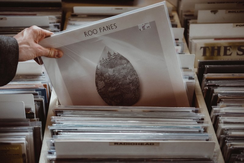 a person picking out a roo panes vinyl record in a record store, this can be my something old 4k