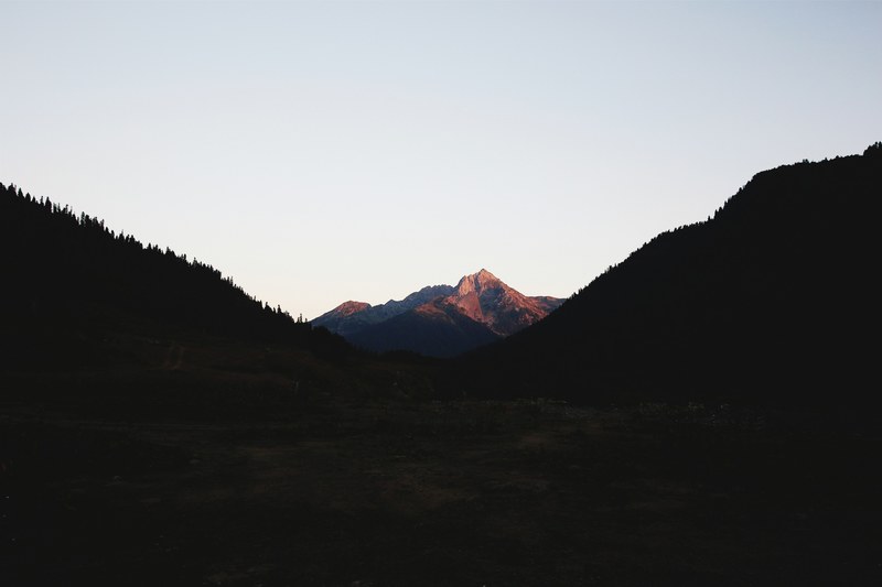 a rugged mountain ridge seen from a wooded mountain pass in abkhazia, auadhara 4k
