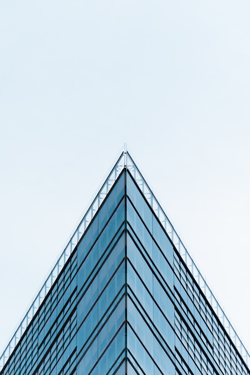 a sharp triangular corner of an office building in berlin, triangular facade corner 4k