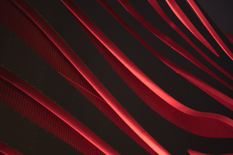 a red line pattern background from architecture at petersen automotive museum, petersen automotive museum 4k