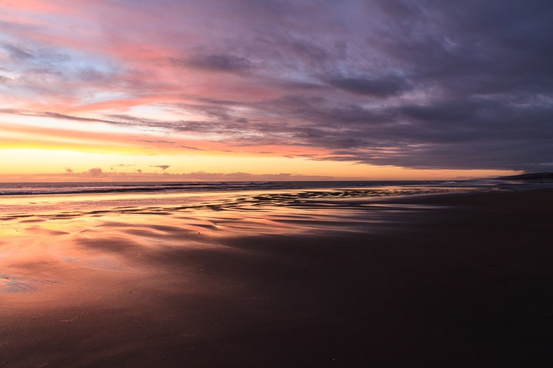 dusk on the sand beach at port waikato tuakau auckland new zealand, sunset beach 4k