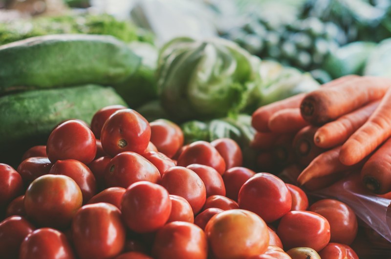 cherry tomatoes carrots lettuce and vegetables in a pile, fresh vegetable produce 4k