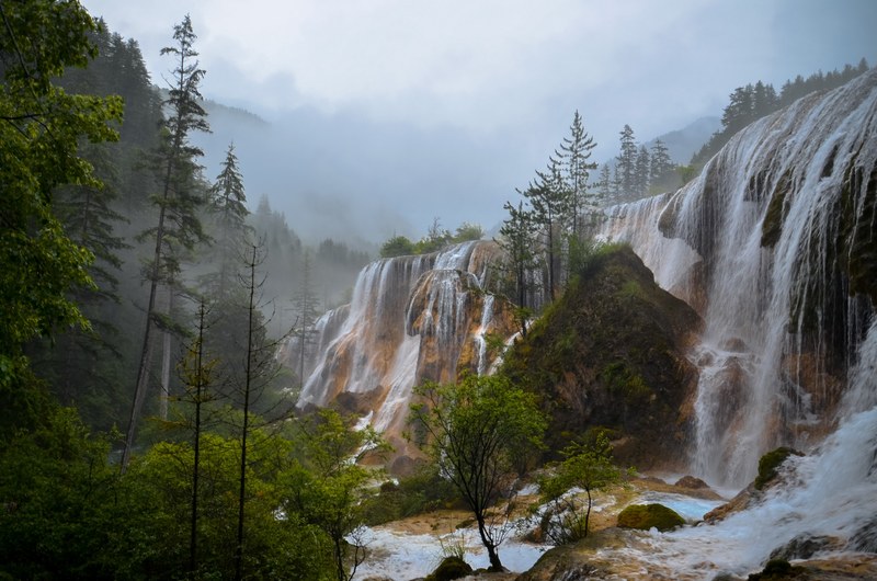 a long row of waterfalls on a cloudy day in aba, impressive waterfalls 4k