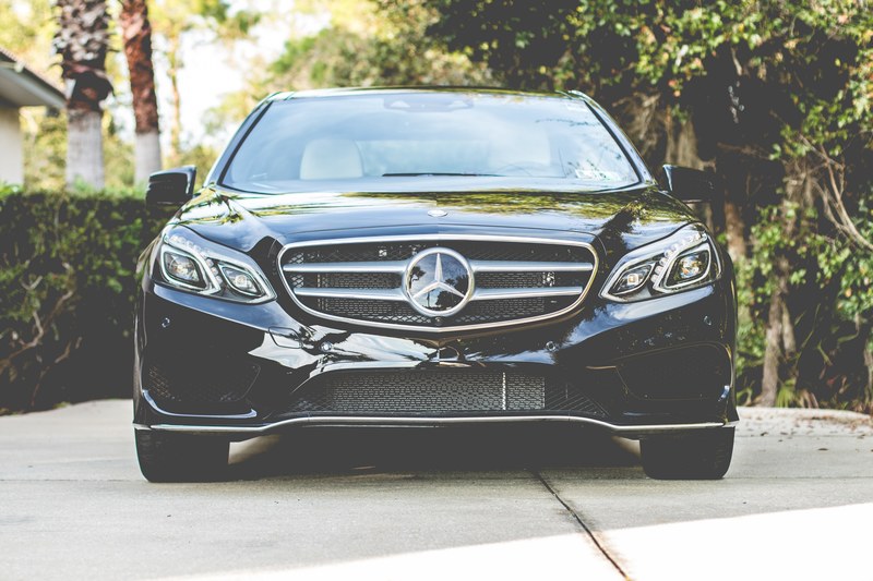 front of the new luxury black mercedes benz parked in a driveway, _front of new black mercedes benz 4k