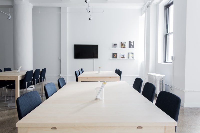 several tables in a sparsely decorated conference room, orderly conference room 4k