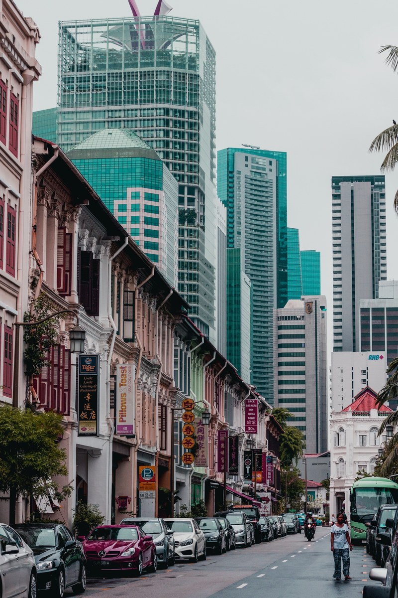 urban storefronts line the streets of singapore, shops and skyscrapers 4k