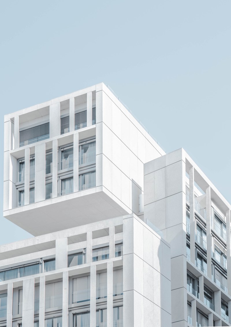 a white concrete apartment building in madrid, white apartment building 4k