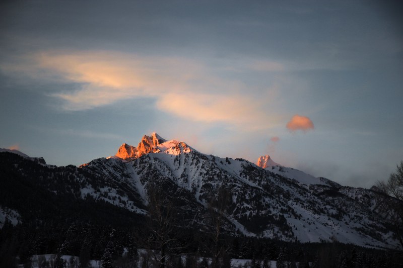 snow capped mountain peaks crown the horizon on a quiet evening, patrick hendry 4k