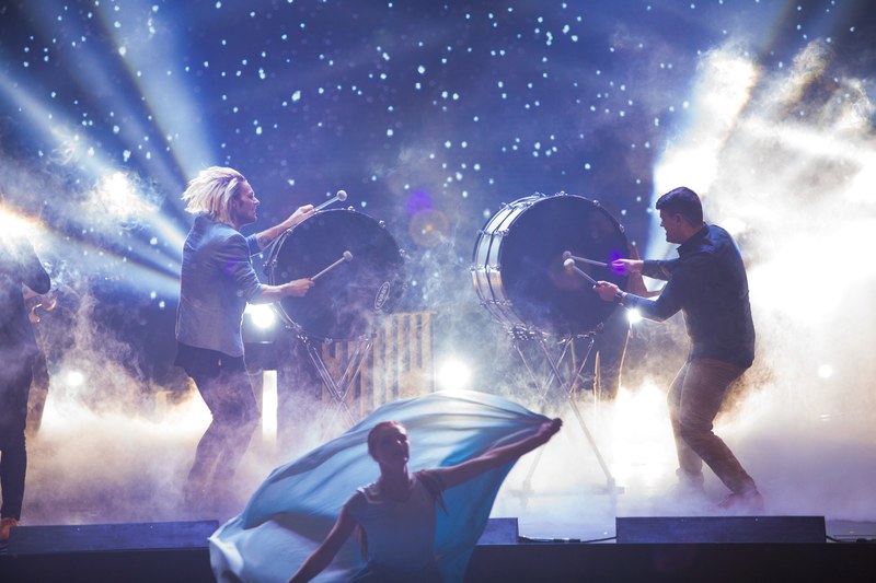 two mean beating the drums on a stage full of smoke and light, christmas at faith chapel 2016 4k