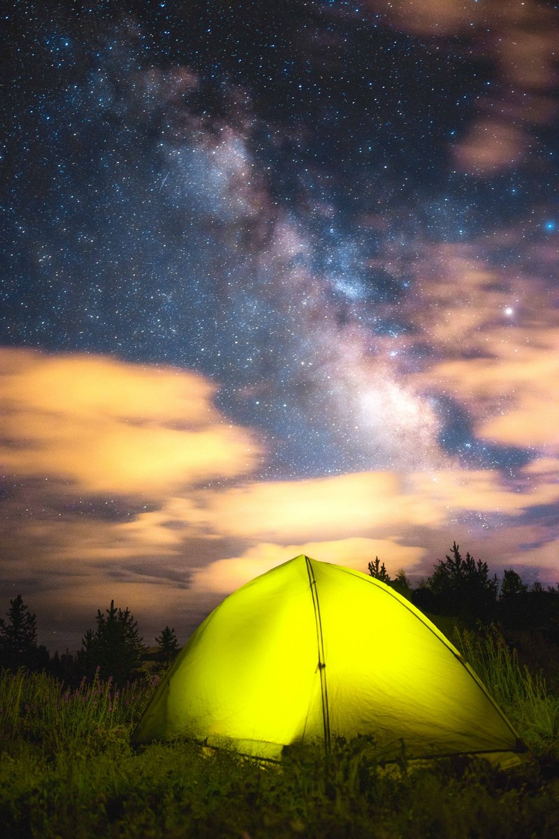 a yellow tight under a vivid night sky, _5 billion star hotel 4k