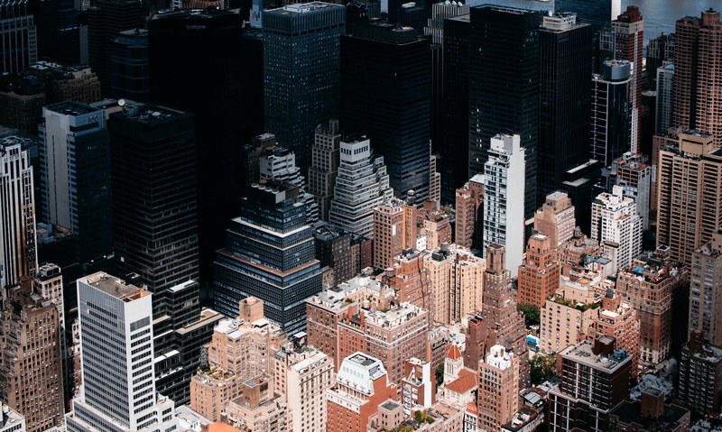 aerial view of new york citys downtown skyscrapers with dark shadow, complementary colors nyc 4k
