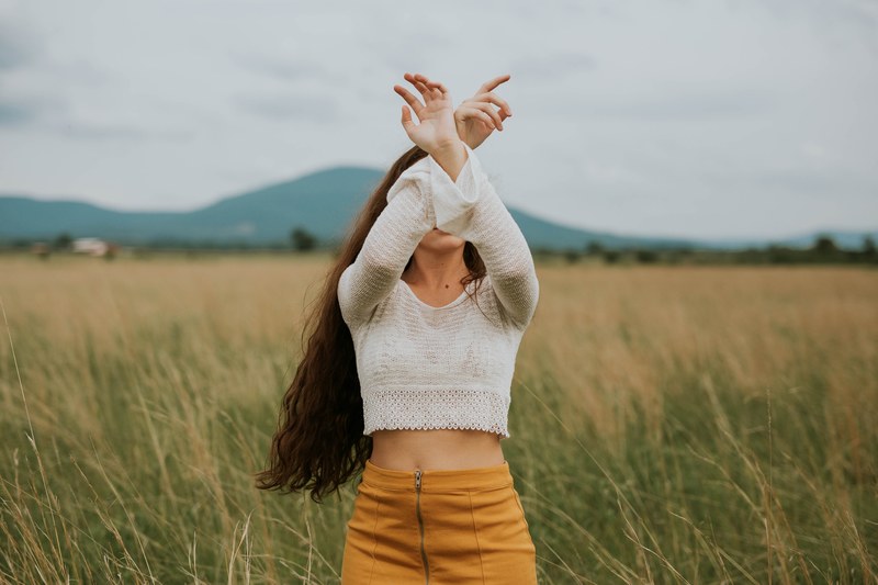 arms raised woman field and skirt 4k
