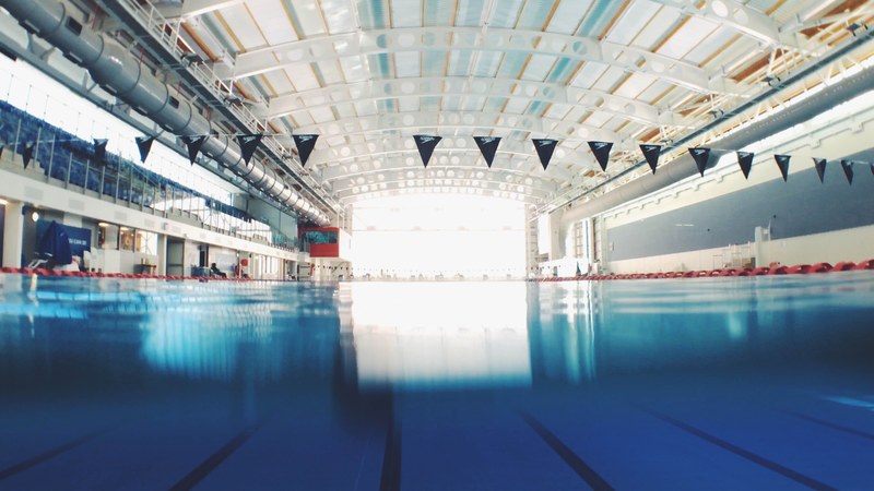 an indoor recreational pool with swimming lanes divided at aut millennium, swimming laps 4k